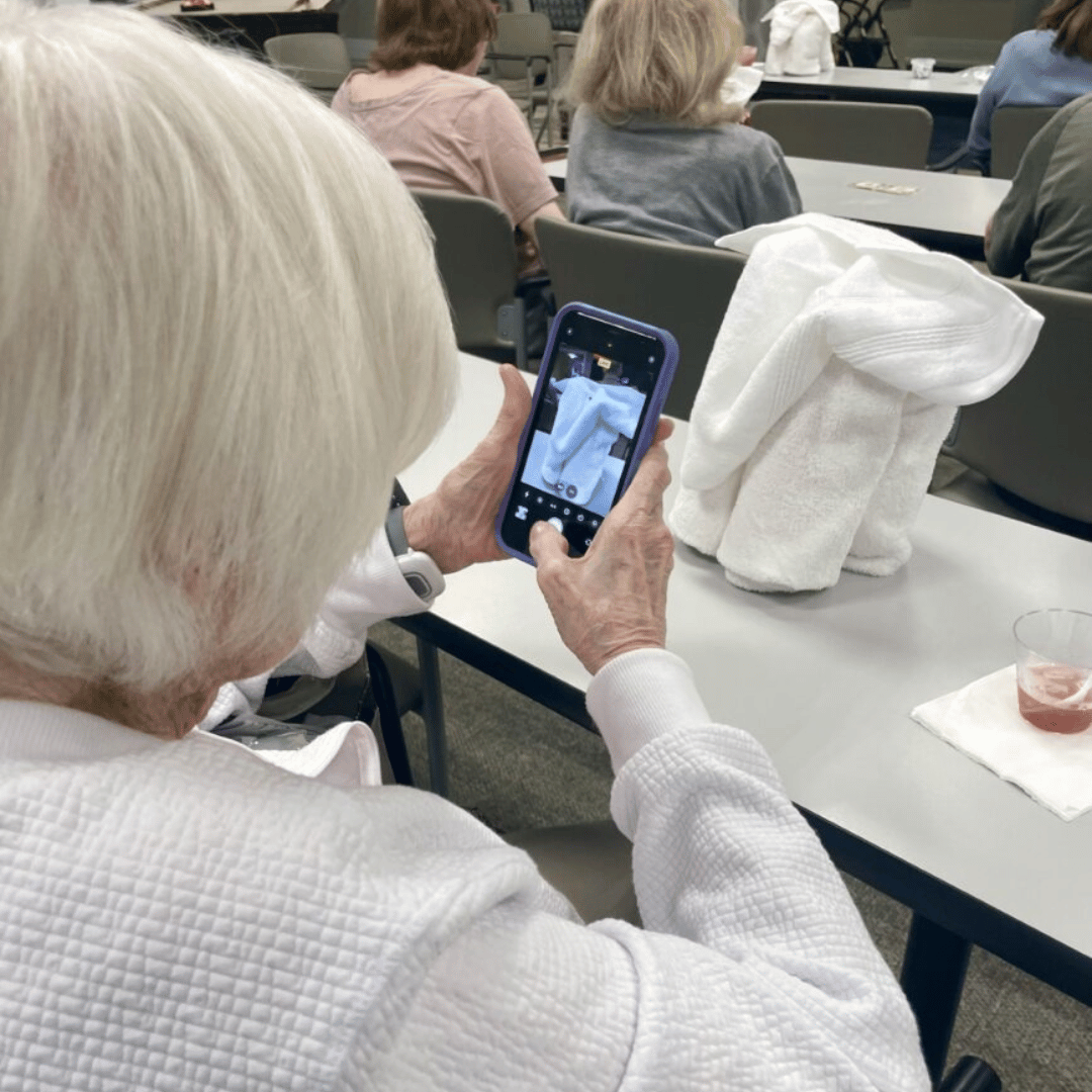 The Bristal at East Northport held an immersive cruise ship program which included learning to fold towel animals