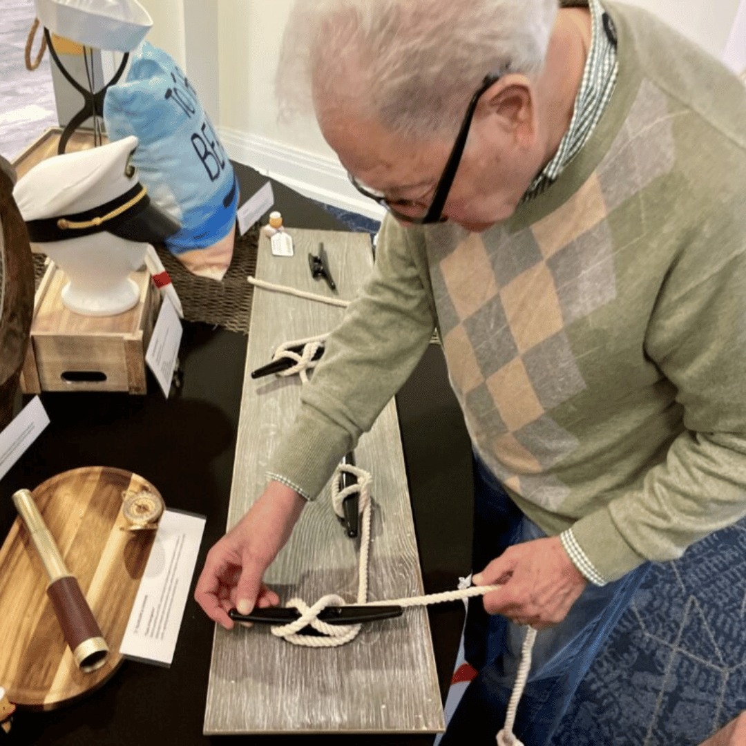 Residents practiced knot tying and learned about cruise ship history
